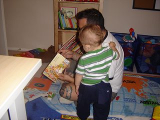 Ed and Santiago reading a book.
